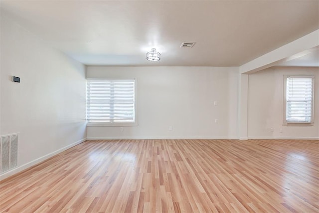 spare room with light hardwood / wood-style floors