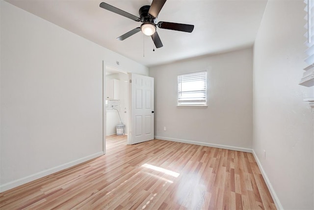 spare room featuring ceiling fan and light hardwood / wood-style flooring