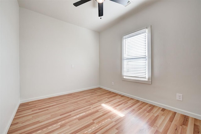 empty room featuring ceiling fan and light hardwood / wood-style flooring