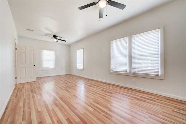 empty room with light wood-type flooring and ceiling fan