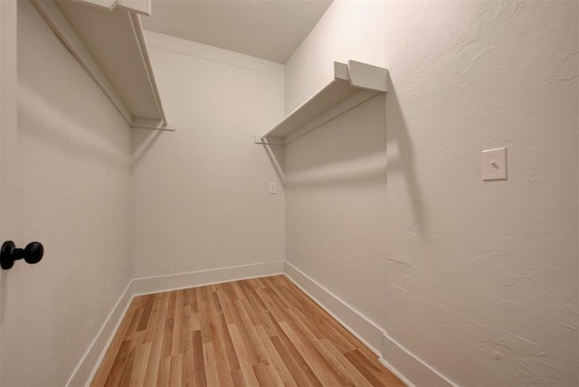 walk in closet featuring light wood-type flooring