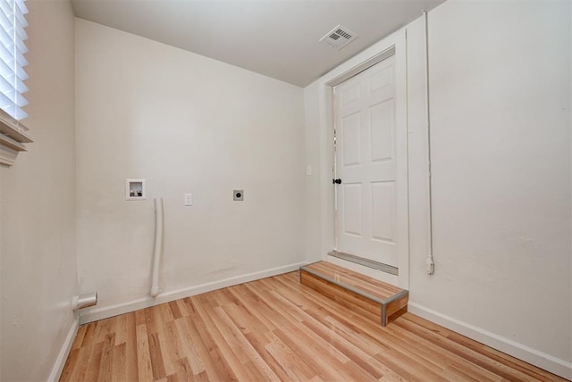 spare room featuring light wood-type flooring