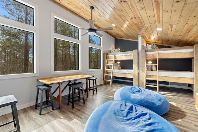 bedroom with wooden ceiling, lofted ceiling, and hardwood / wood-style flooring