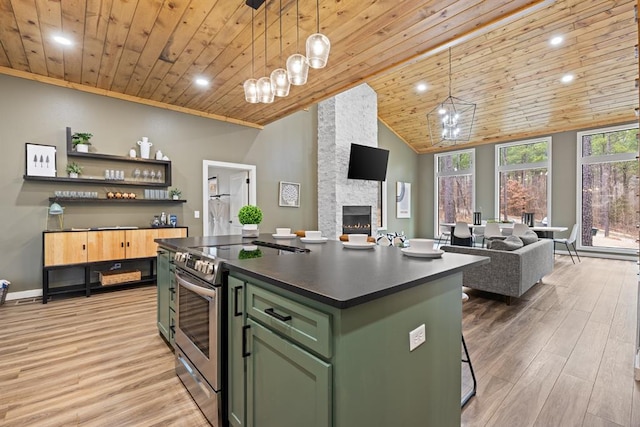 kitchen featuring a center island, hanging light fixtures, wooden ceiling, and electric stove