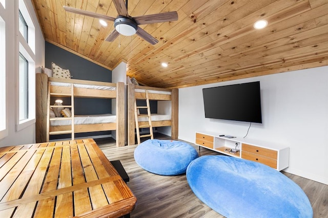 bedroom featuring hardwood / wood-style flooring, vaulted ceiling, and wooden ceiling