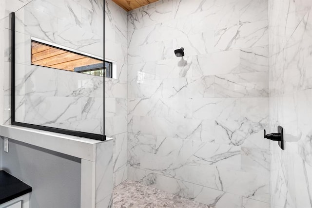 bathroom featuring a tile shower