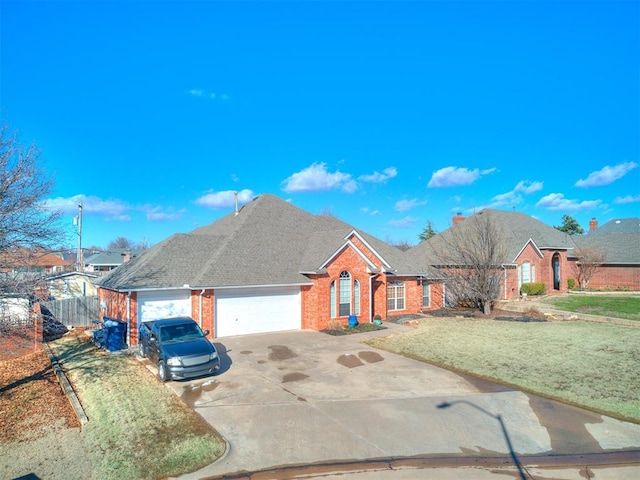 view of front of house with a front lawn and a garage