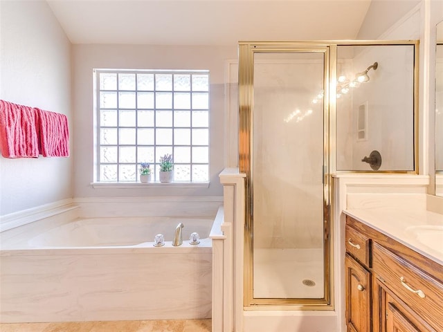 bathroom with vanity, independent shower and bath, and lofted ceiling