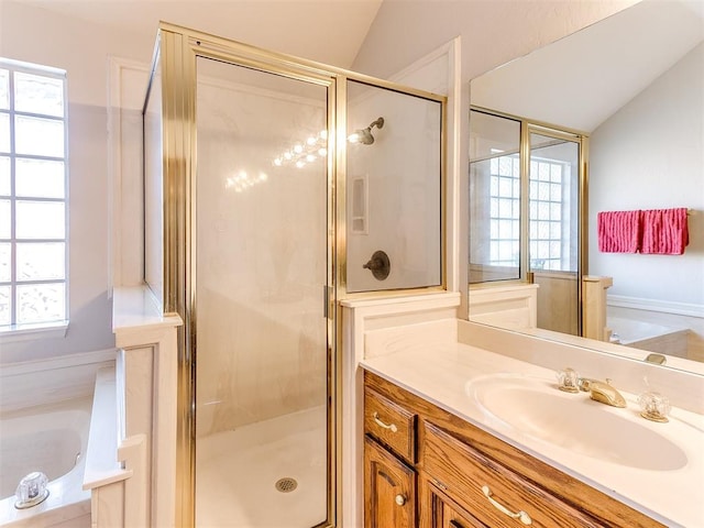 bathroom featuring vanity, plus walk in shower, and vaulted ceiling