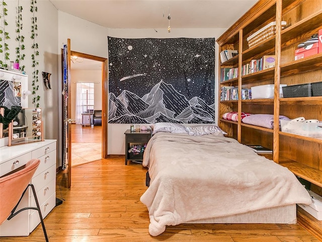 bedroom with light hardwood / wood-style floors