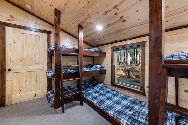 bedroom with wood walls, lofted ceiling, and wooden ceiling