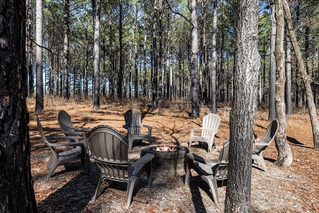 view of yard with an outdoor fire pit