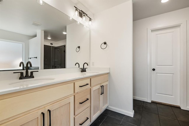 bathroom featuring tile patterned flooring, vanity, and an enclosed shower