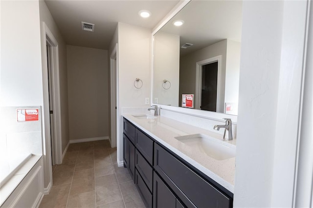 bathroom featuring tile patterned floors and vanity