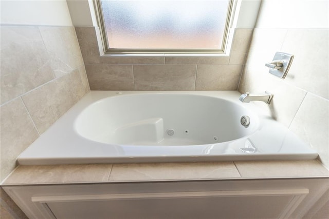 bathroom with a tub to relax in