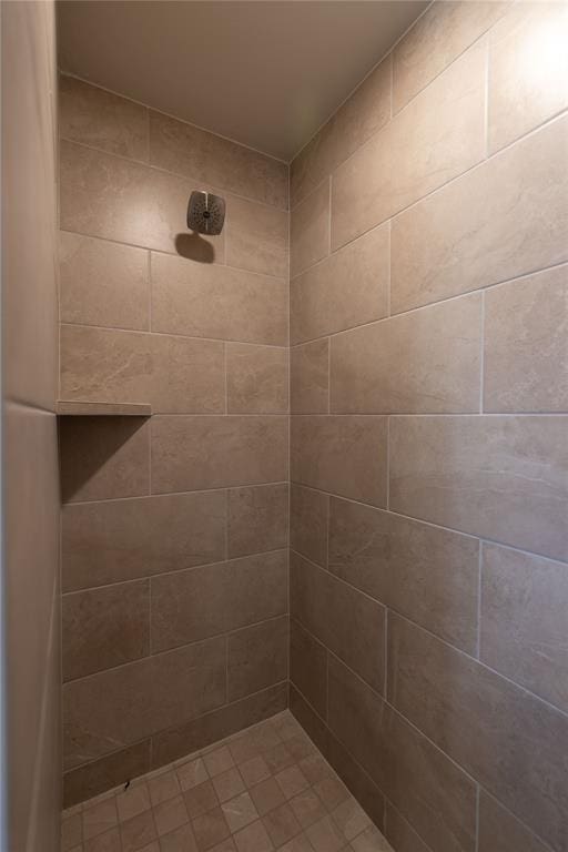 bathroom with tiled shower