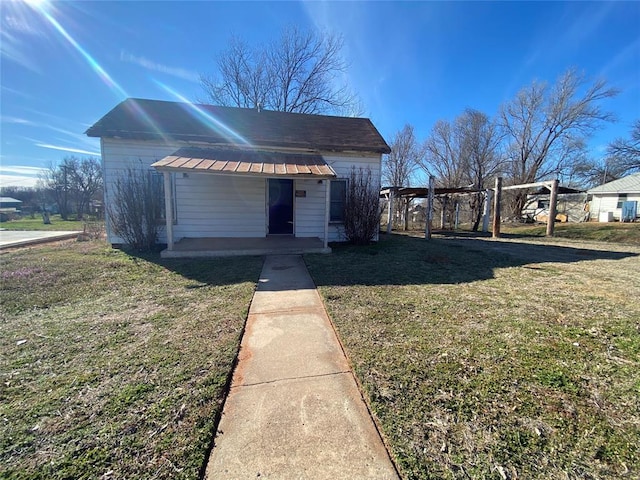 view of outbuilding with a lawn