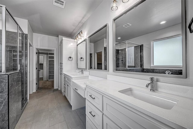 bathroom featuring vanity, wood-type flooring, and a shower with door