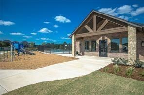 view of property's community with a playground