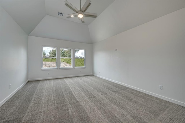 unfurnished room with carpet, vaulted ceiling, and ceiling fan