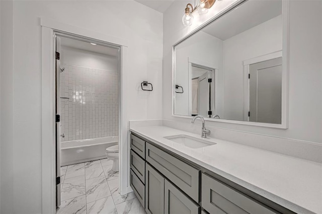 full bathroom with vanity, toilet, and tiled shower / bath