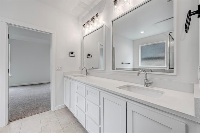 bathroom with tile patterned flooring and vanity