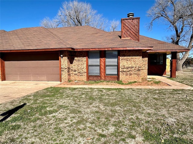 view of front of house featuring a garage and a front lawn