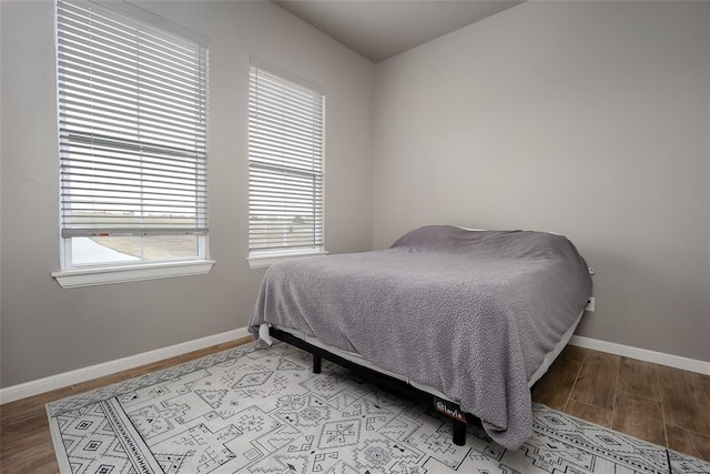 bedroom featuring light wood-type flooring and multiple windows