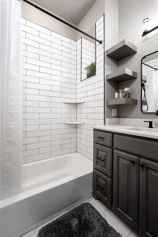 bathroom featuring vanity and shower / bath combination with curtain