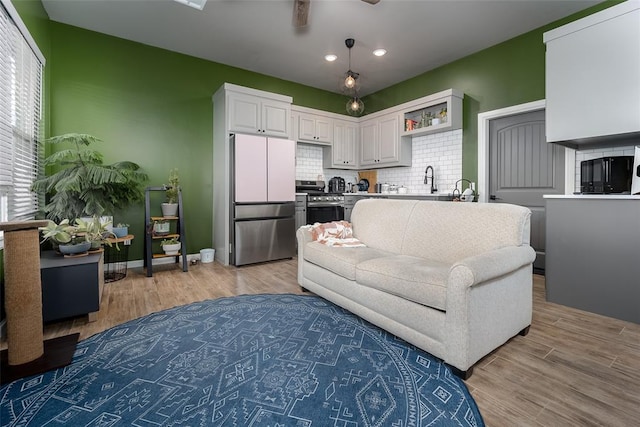 living room with light hardwood / wood-style floors