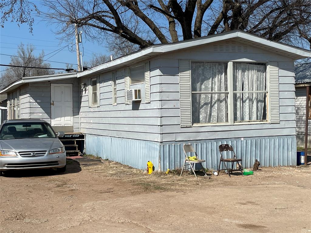 view of side of property with cooling unit