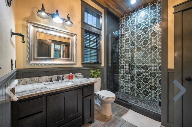 bathroom with wood-type flooring, an enclosed shower, toilet, vanity, and wood ceiling