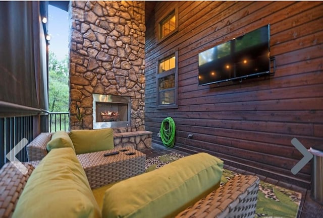 exterior space with an outdoor stone fireplace