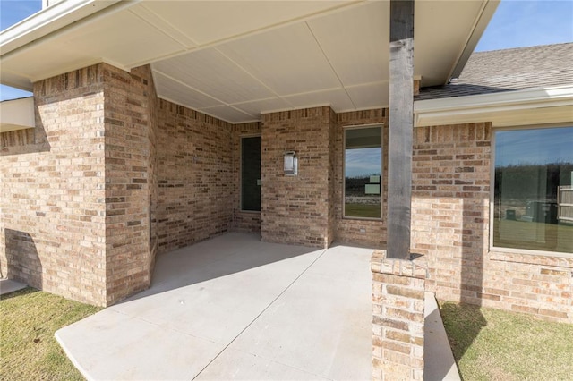 entrance to property with a patio area