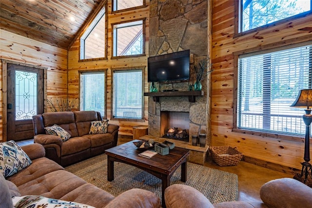 living room featuring a stone fireplace, wood ceiling, high vaulted ceiling, wooden walls, and beamed ceiling