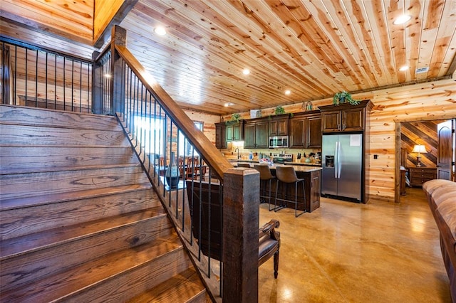 stairway with sink and wooden ceiling