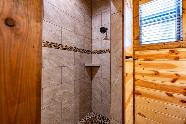 bathroom with a tile shower