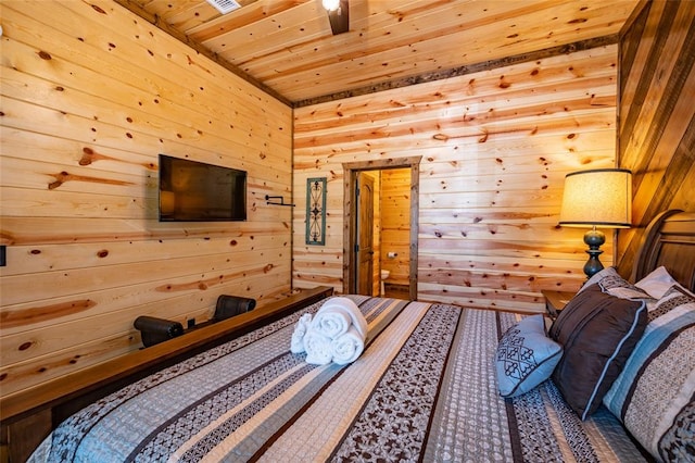 bedroom featuring wooden ceiling and wood walls