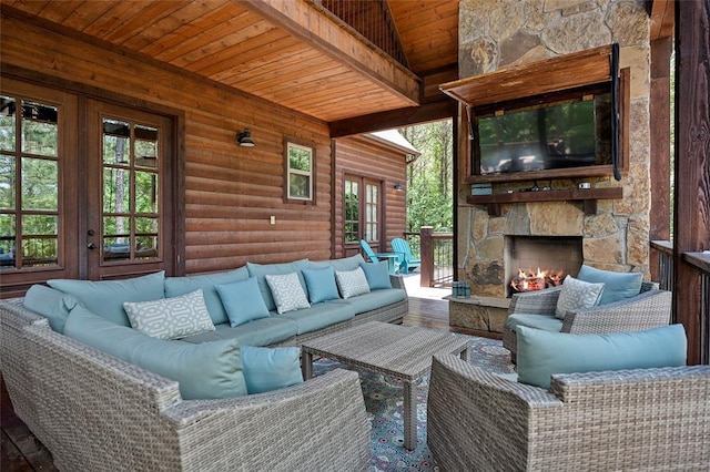 exterior space featuring french doors and an outdoor living space with a fireplace