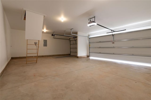 garage featuring electric panel and a garage door opener