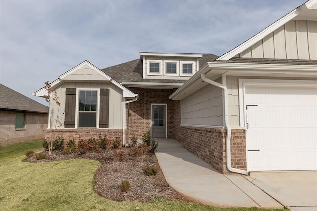 view of front of house with a front yard and a garage