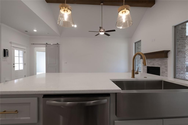 kitchen featuring dishwasher, sink, vaulted ceiling, ceiling fan, and a barn door