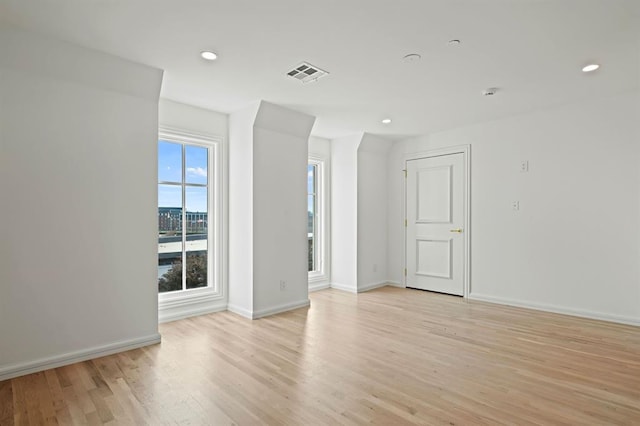 spare room featuring light hardwood / wood-style floors