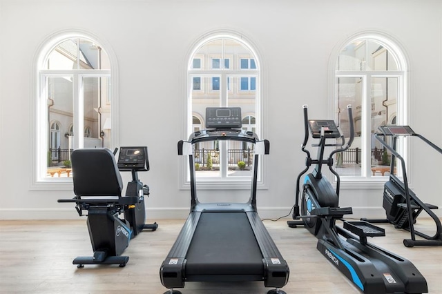 exercise area with light wood-type flooring