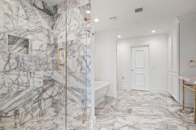 bathroom featuring independent shower and bath