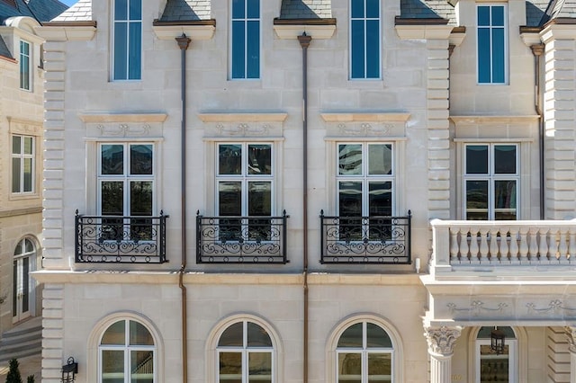 back of house featuring a balcony