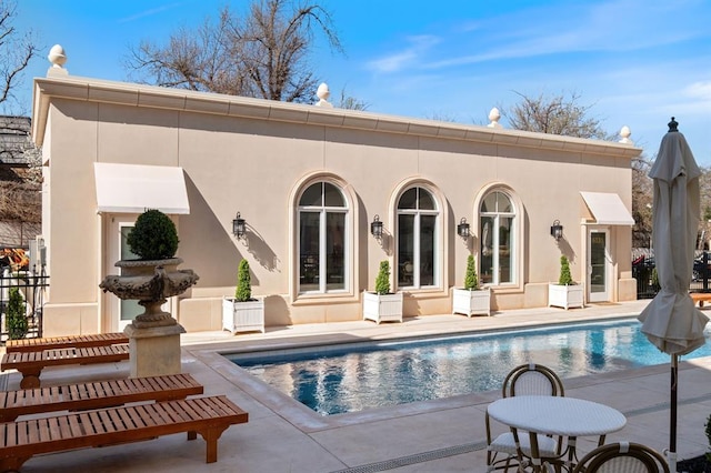 back of house featuring a patio