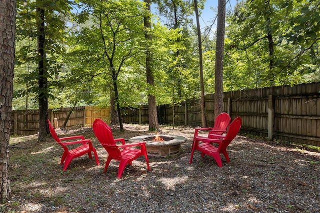 view of yard with an outdoor fire pit