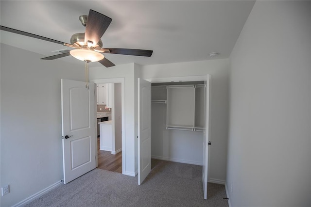 8800 Tyrion Dr, Edmond, OK 73007 - unfurnished bedroom featuring light carpet, a closet, and a ceiling fan