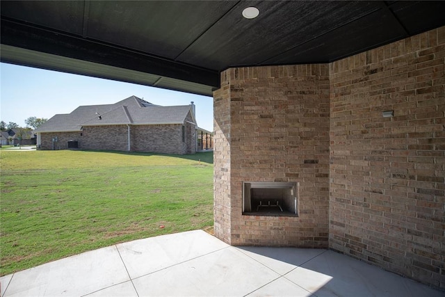 8800 Tyrion Dr, Edmond, OK 73007 - view of patio / terrace featuring an outdoor brick fireplace